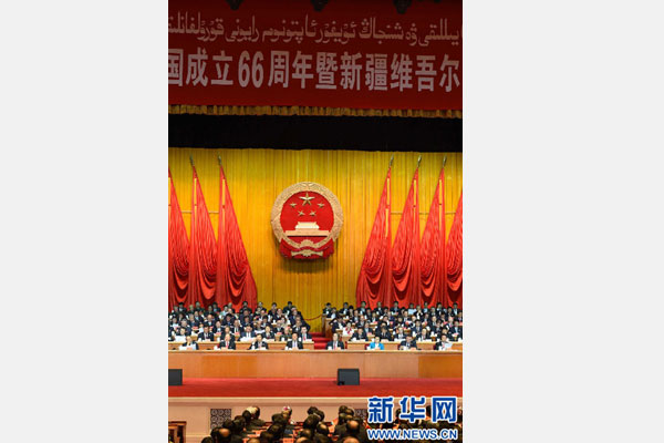 10月1日，慶祝中華人民共和國成立66周年暨新疆維吾爾自治區(qū)成立60周年大會在新疆人民會堂隆重舉行。 新華社記者 高潔 攝 